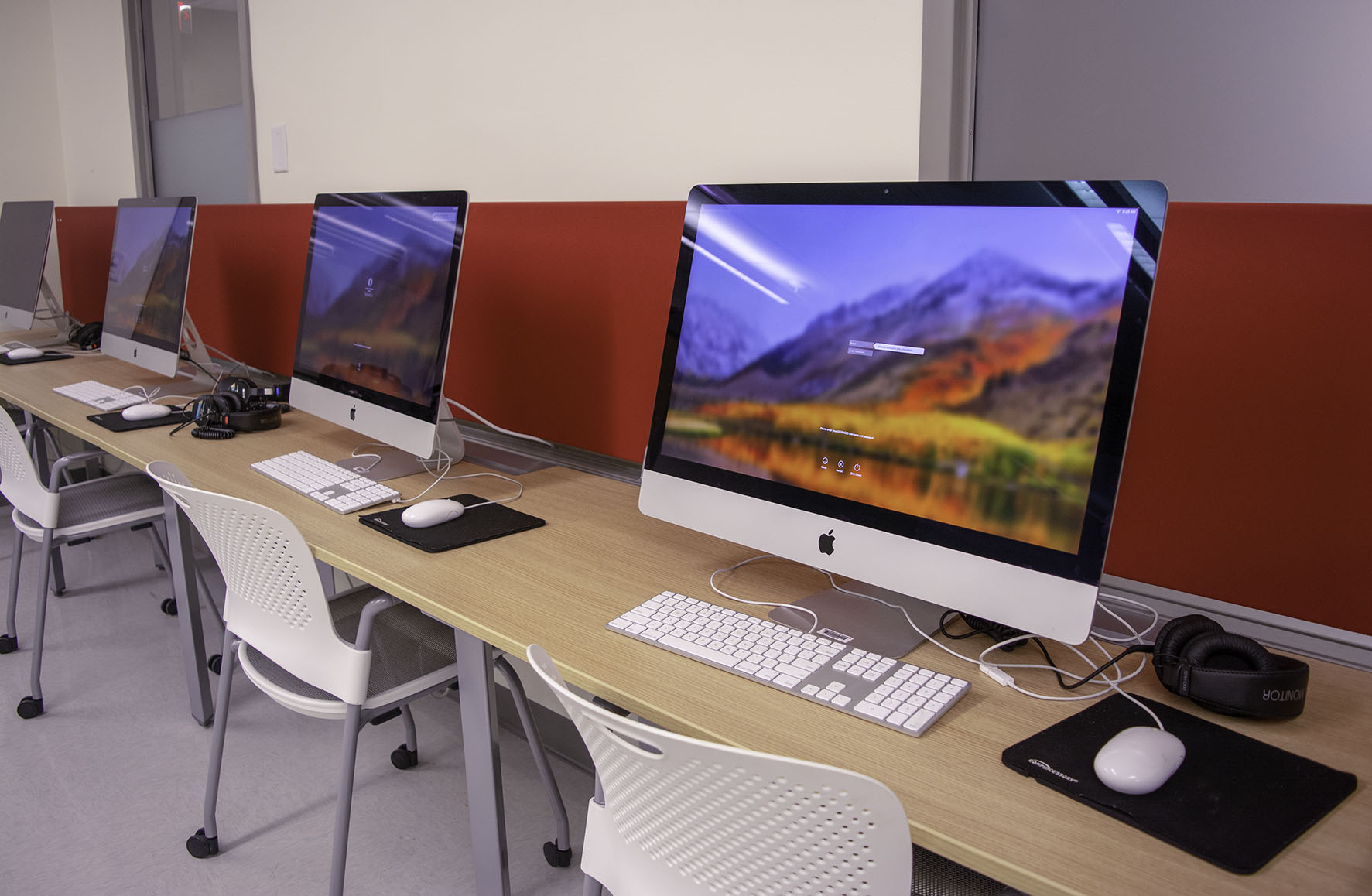 iMac computers at tables in Media Editing Lab
