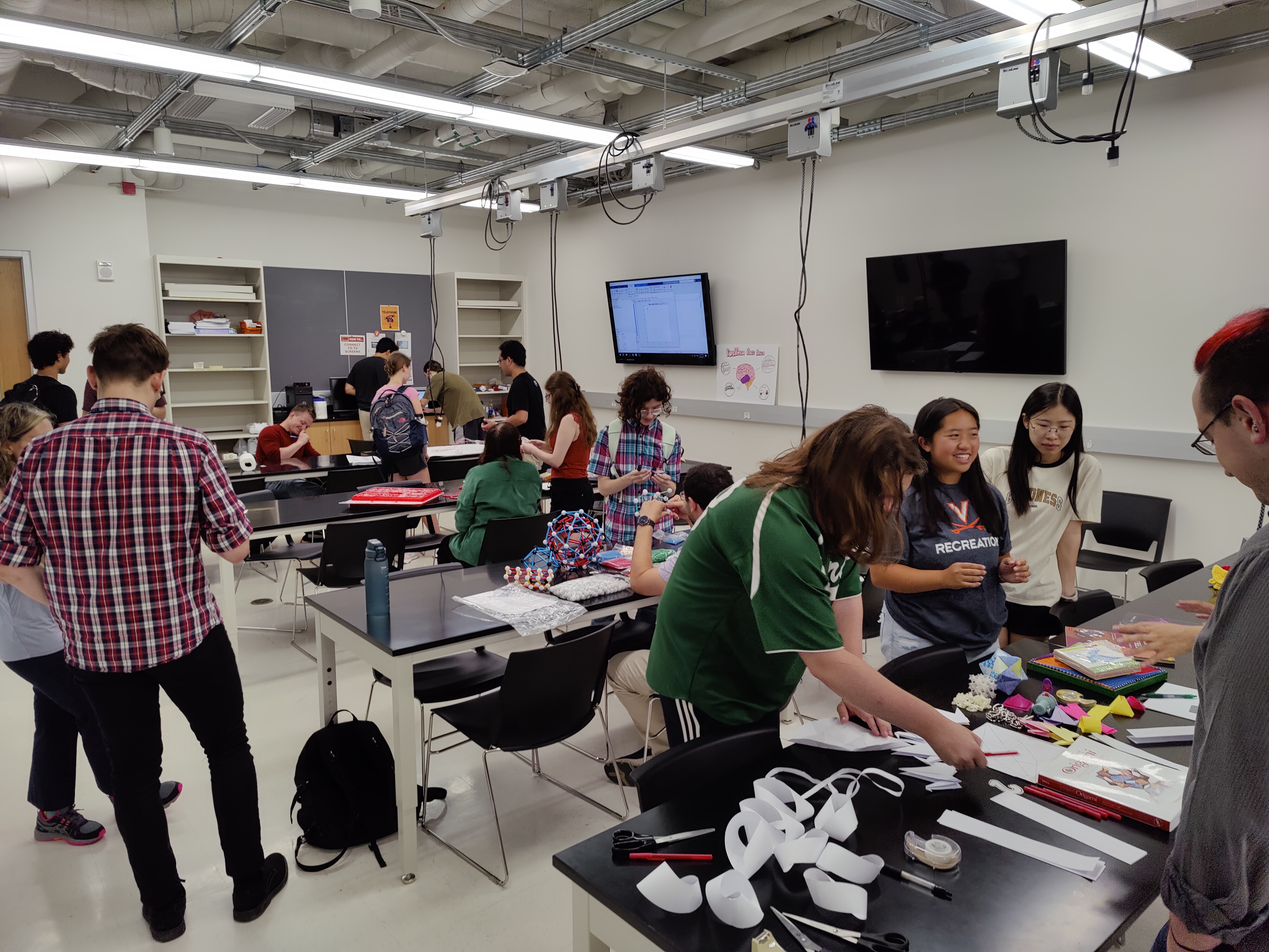 students in a workshop doing various physical math projects