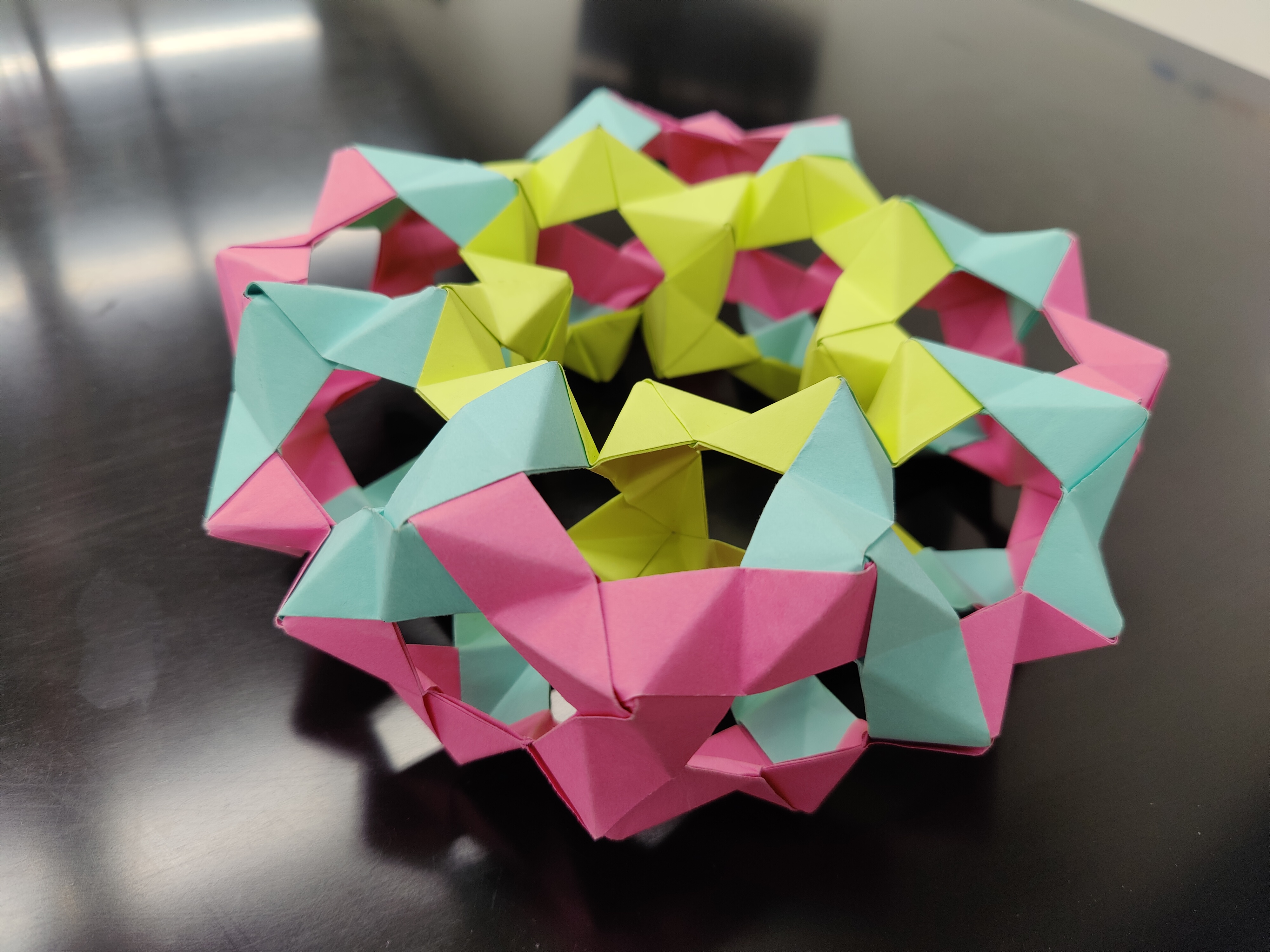 A folded geometric produced by Professor Sara Maloni's mathematics class "Geometry Lab"