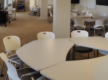 A photo of chairs around a table in a study space